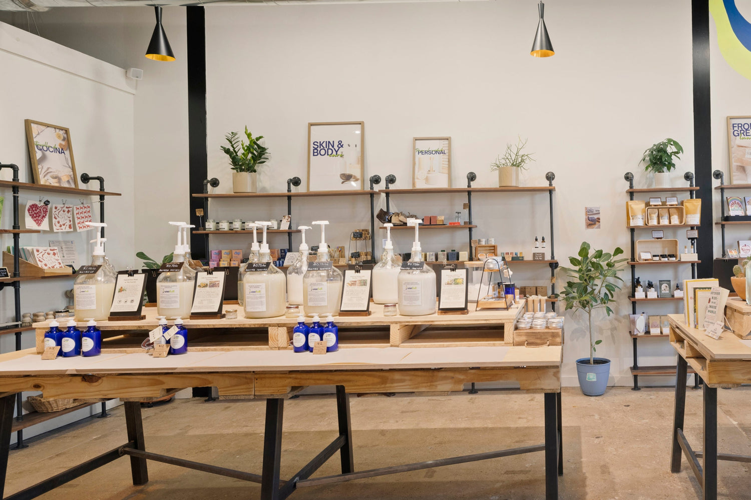 Store interior with wooden tables and shelves displaying ecofriendly items.